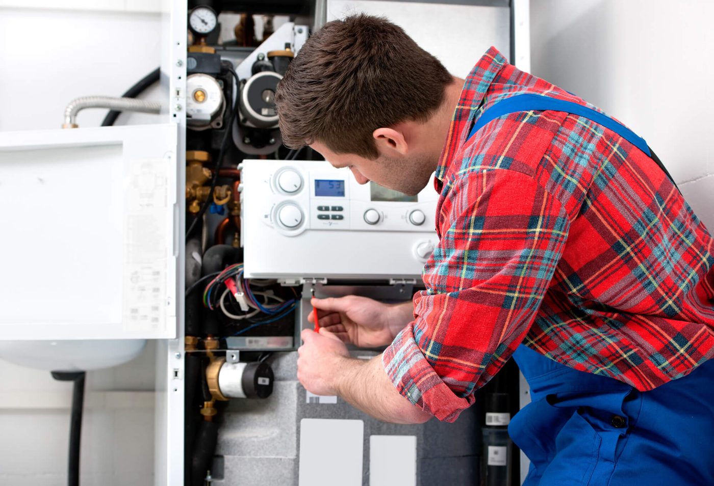 Technician servicing boiler in Vancouver
